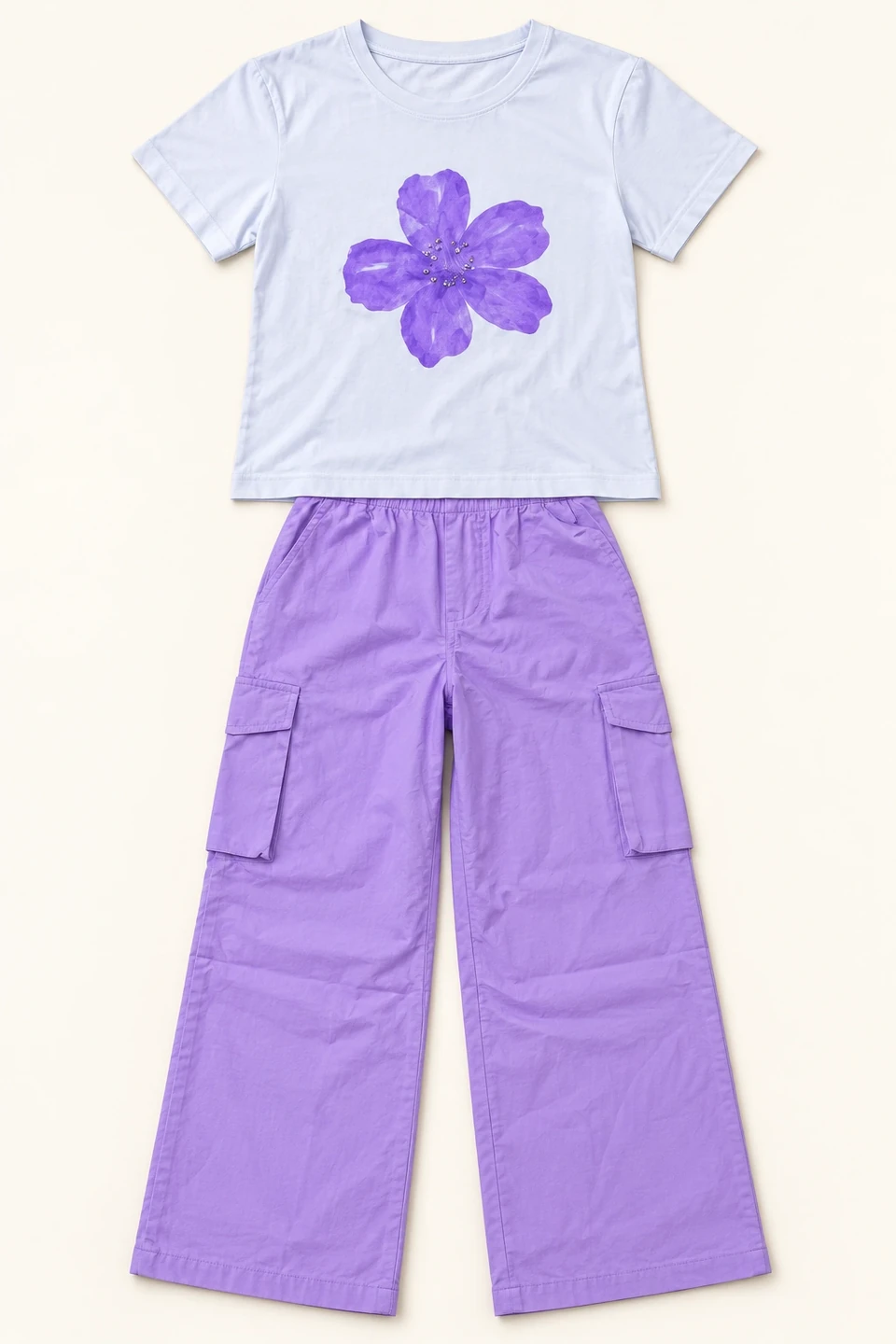 Purple Flower T-shirt and Lavender Cargo Trouser Set on a warm studio background