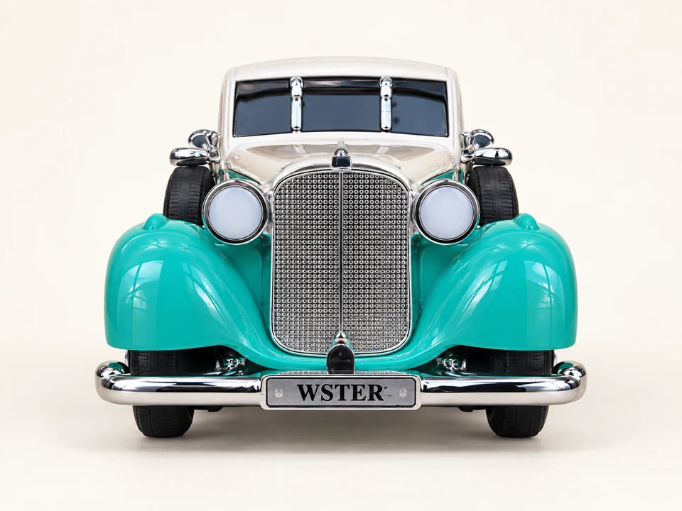 Turquoise Vintage Style Toy Car on a warm studio background