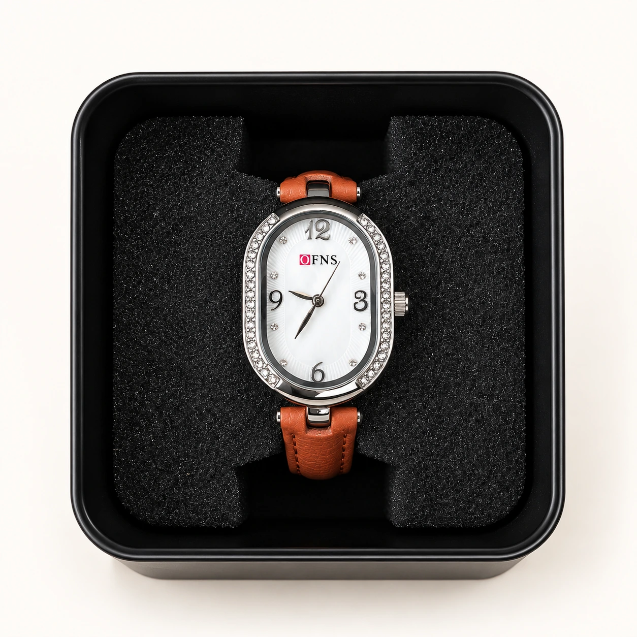 Silver Oval Brown Strap Watch on a neutral studio background